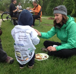 The youngest rider shares a snack.